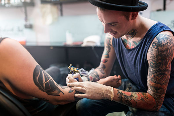 Tattooist and body piercer